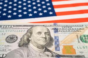 US dollar banknotes on USA America flag background, Business and finance. photo
