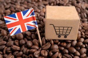 United Kingdom flag with shopping cart on coffee bean, import export trade online commerce. photo