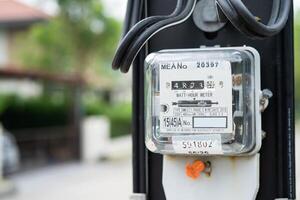 Bangkok, Thailand April 10, 2023,Electric measuring power meter for energy cost at home and office. photo