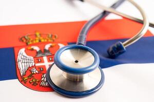 Stethoscope on Serbia flag background, Business and finance concept. photo