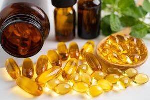 Fish oil vitamin with EPA and DHA,Alternative medicine herbal organic capsule with vitamin E omega 3. photo