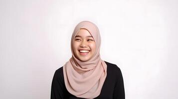 AI generated Radiant smile of a beautiful Asian woman with a hijab, capturing genuine joy and warmth, against a gray background photo