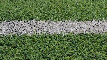 The marking line of the sports ground with an artificial turf detailed photo