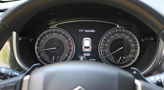 Parking Assistant Icon Between Speedometer And Tachometer On Car Dashboard photo