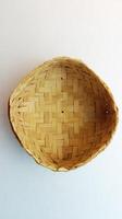 Besek or woven bamboo is a traditional food box made of woven bamboo photo