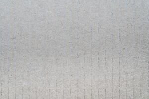 Surface sheet recycled cardboard. Close-up abstract gray texture carton pattern photo