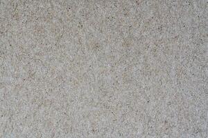 Light brown background from sheet of recycled cardboard photo