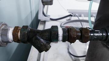 thread connection pipe valve with seal tape for protection of leak. photo