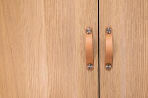 Wooden Closet doors close up background texture modern design. Cozy apartment details. Closet usage. photo