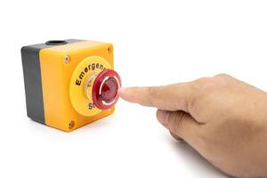 Stop Button and the Hand of Worker About to Press it. emergency stop button. Big Red emergency button or stop button for manual pressing. isolated on white background. photo