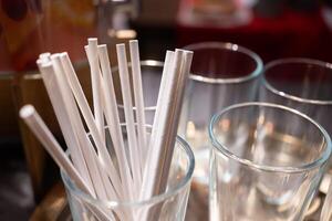 Paper straws made of eco friendly paper. Close up on white paper straws facing upwards. ecologically friendly yet durable paper drinking straws. photo