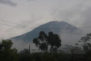 Mount Sumbing is located in Central Java during the rainy season photo