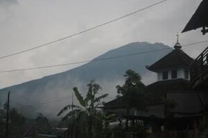 Mount Sumbing is located in Central Java during the rainy season photo