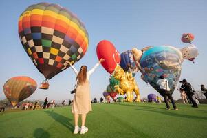 Chiang Rai, Thailand - February-14-2024 - International ballon fiesta 2024 festival in Singha park, Chiang Rai. This event is the year to experience giant balloons up close in Thailand. photo