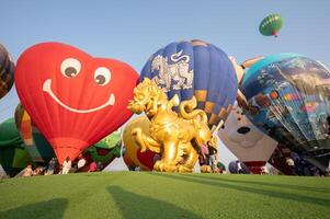 Chiang Rai, Thailand - February-14-2024 - International ballon fiesta 2024 festival in Singha park, Chiang Rai. This event is the year to experience giant balloons up close in Thailand. photo