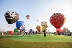 Chiang Rai, Thailand - February-14-2024 - International ballon fiesta 2024 festival in Singha park, Chiang Rai. This event is the year to experience giant balloons up close in Thailand. photo