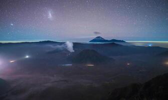 Night view of Mount Bromo an active volcano part of the Tengger massif, in East Java, Indonesia. photo
