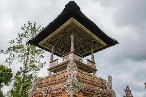 The spiritual shrine in Pura Taman Ayun the royal temple of Mengwi empire in Badung Regency, Bali, Indonesia. View in the Cloudy day. photo