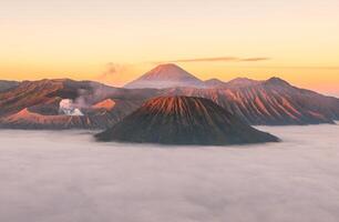 Spectacular sunrise view of Mount Bromo an active volcano part of the Tengger massif, in East Java, Indonesia. photo