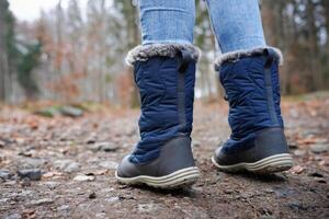 Rear view of traveler in hiking boots photo