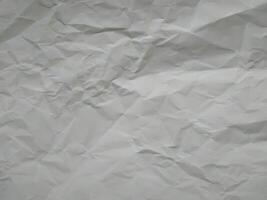 Crumpled white paper texture or paper background for design with copy space for text or image photo