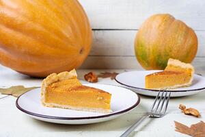 Pumpkin tart for autumn holidays. American pumpkin pie. Halloween background. photo