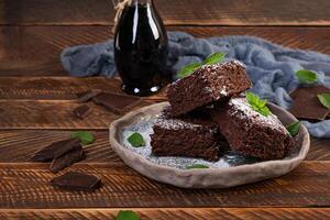 Delicious dessert chocolate banana brownie. Homemade bakery, brownie with mint leaves photo