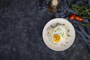 Croque madame with bechamel sauce. Freanch toasts with ham, cheese and fried egg photo