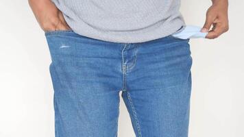 young man shows empty pant pocket with copy space video