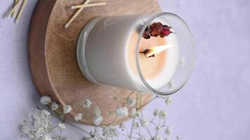 Aromatic candle on the table.  Soy candles  in a jar. Aromatherapy and relax in spa and home. Still life. video