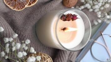 Aromatic candle on the table.  Soy candles  in a jar. Aromatherapy and relax in spa and home. Still life. video