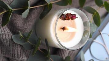 Aromatic candle on the table.  Soy candles  in a jar. Aromatherapy and relax in spa and home. Still life. video