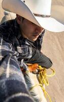 Man taking a walk with friends on horseback in hat through semi-deserted countryside, with space for text photo