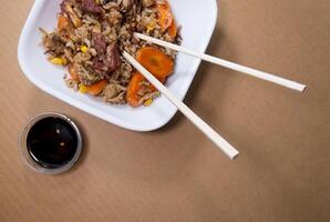 Freshly made Chinese fried rice with meat and vegetables, with space for text photo