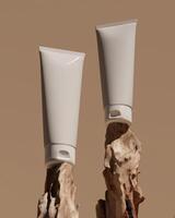 Two tubes of sunscreen placed on a log in a warm scene. Clipping path of each element included. 3D rendering illustration. photo
