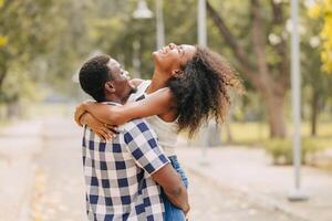 Date couple man and women valentine day. African black lover at park outdoors summer season vintage color tone photo