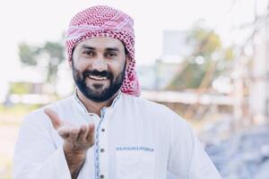 Arab male hand rise open palm for asking help share giving or donation concept happy smile photo