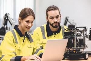 Electronics Engineer Team Works with IOT Robot Checking Source Code and Program AI System. Automation Computer Science Research Laboratory with Specialists Working. photo