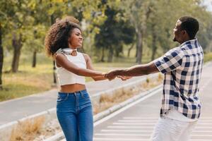 Date couple man and women valentine day. African black lover at park outdoors summer season vintage color tone photo