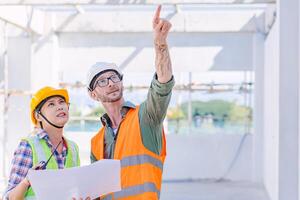 engineer worker team builder working together teamwork talking together work at construction site photo