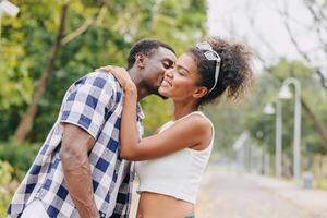 Date couple man and women valentine day. African black lover at park outdoors summer season vintage color tone photo