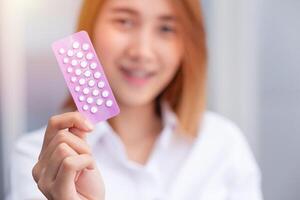 teen girl with birth control pills Combined Oral Contraceptive Pill, COCP show up happy smile photo