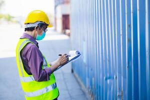 Customs Senior elder Asian Officer worker working in port cargo shipping checking load container photo