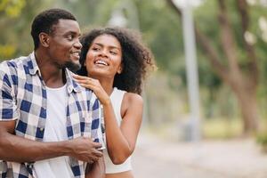 Date couple man and women valentine day. African black lover at park outdoors summer season vintage color tone photo