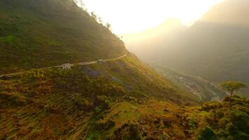 Aerial view of a valley in the mountains on the Ha Giang Loop at sunset, Vietnam video