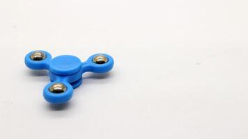 Blue fidget spinner isolated photo