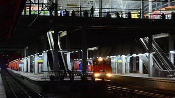 The front view of the train is waiting for passengers photo