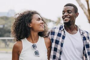 Date couple man and women valentine day. African black lover at park outdoors summer season vintage color tone photo