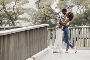 Date couple man and women valentine day. African black lover at park outdoors summer season vintage color tone photo