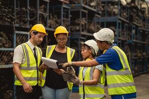 group of engineer industry worker team working together help solving problem in metal factory photo